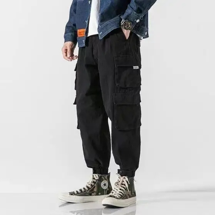 Men's tapered cargo pants, versatile for streetwear or casual wear, showcasing durable construction.