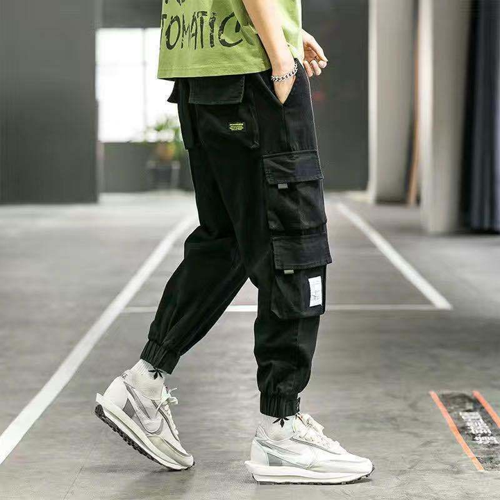Durable men's tapered cargo pants in a versatile khaki, great for casual wear & utility.