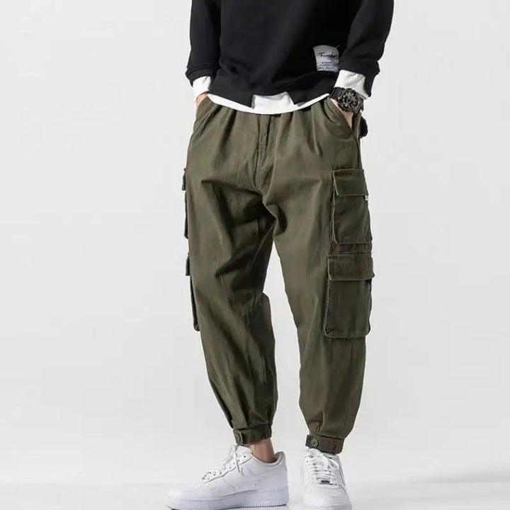Versatile black men's tapered cargo pants with ample pockets, suitable for various casual occasions.