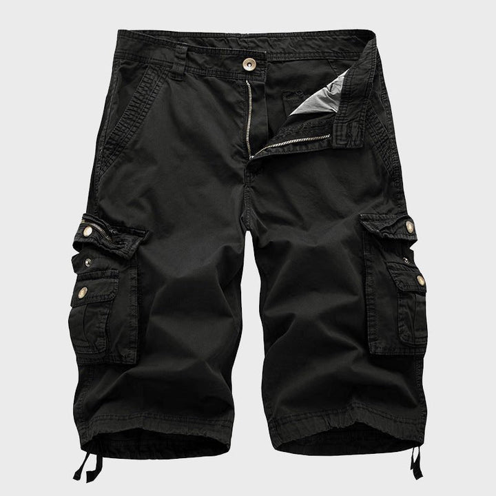 Close-up of men's knee-length cargo shorts, highlighting multiple functional pockets and comfortable drawstring hems.