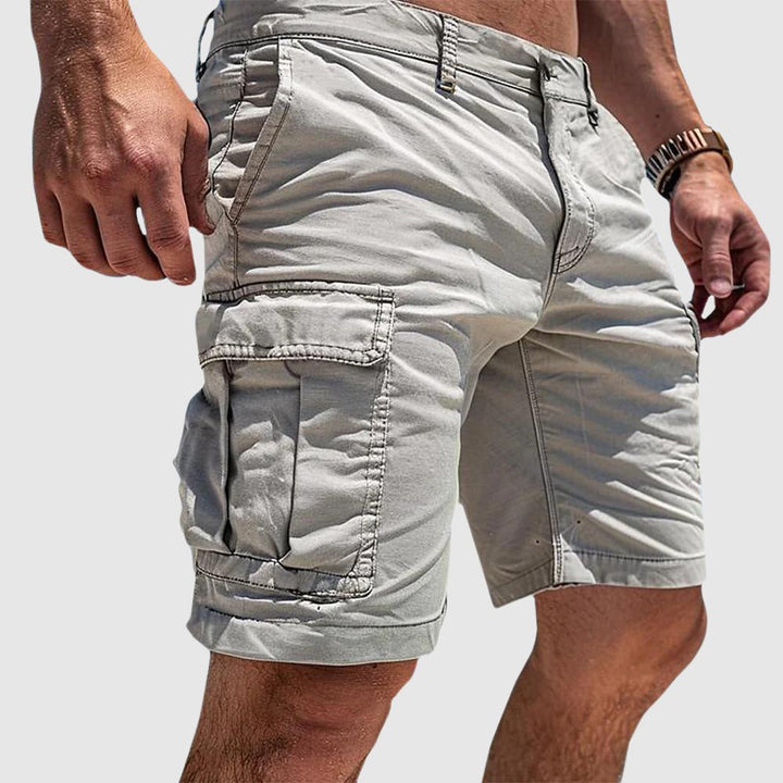 Men's knee-length cargo shorts, perfect for casual wear, featuring multiple secure flap pockets for utility and convenience.