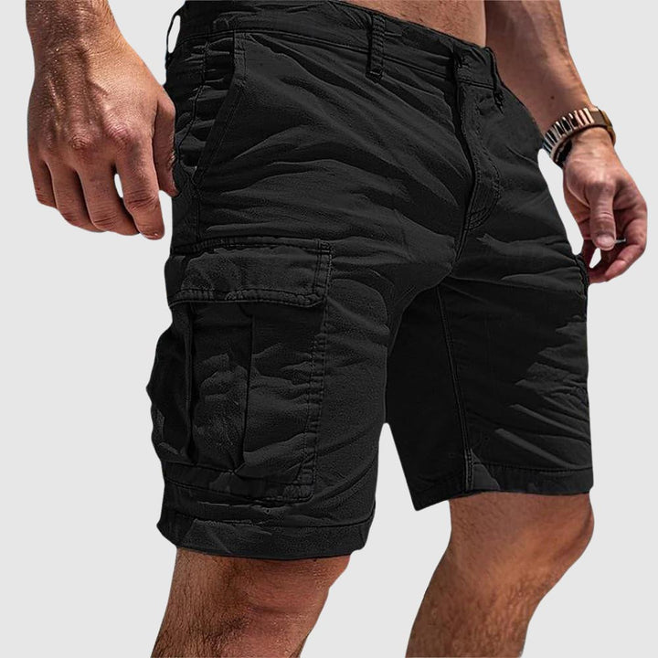 Comfortable men's knee-length cargo shorts with secure flap pockets, great for everyday casual wear and multi-pocket utility.