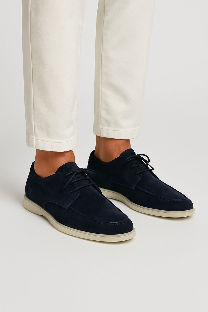 Classic men's lace-up moccasin loafers with a flexible sole, offering timeless style and comfort for everyday wear.
