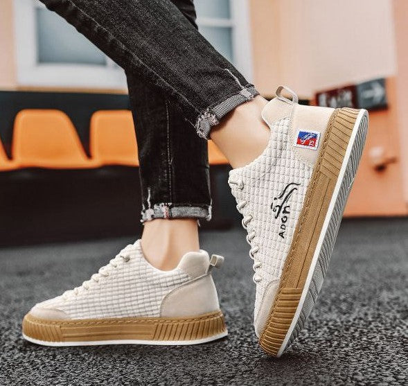 Men's lace-up quilted low top sneakers, perfect for comfortable casual everyday wear.