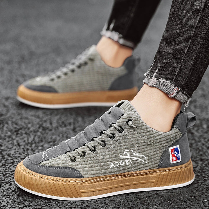 Fashion-forward men's low top sneakers, lace-up quilted design offers a modern casual look.