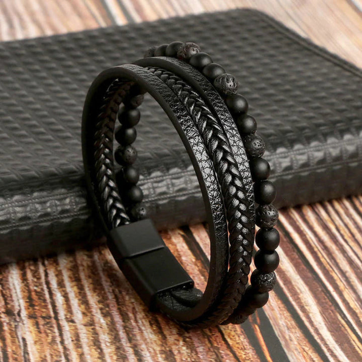 Stylish men's layered leather bracelet with black/brown/blue stone beads. Modern punk-style men's jewelry.