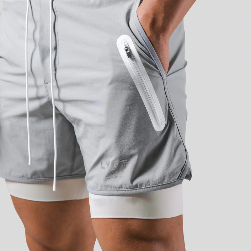 Lightweight, quick-dry men's layered shorts with a zip pocket, perfect for warm-weather running & sports.