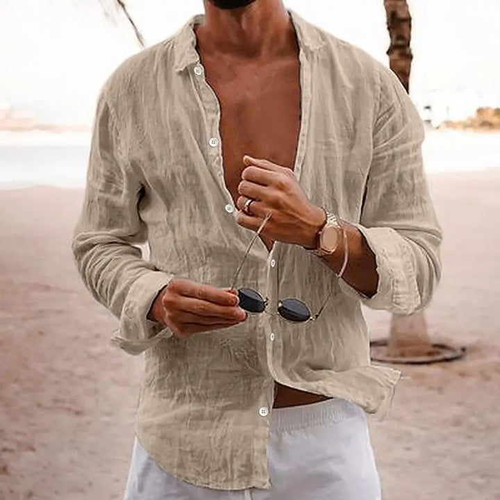 Versatile men's light blue long sleeve casual shirt, great for summer, beach, or holiday fashion.