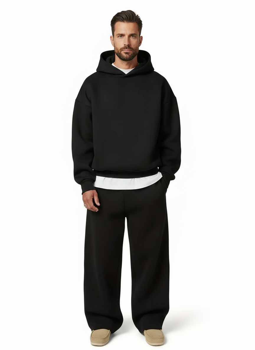 Black men's oversized jogger tracksuit for athletic casual wear & modern loungewear style.
