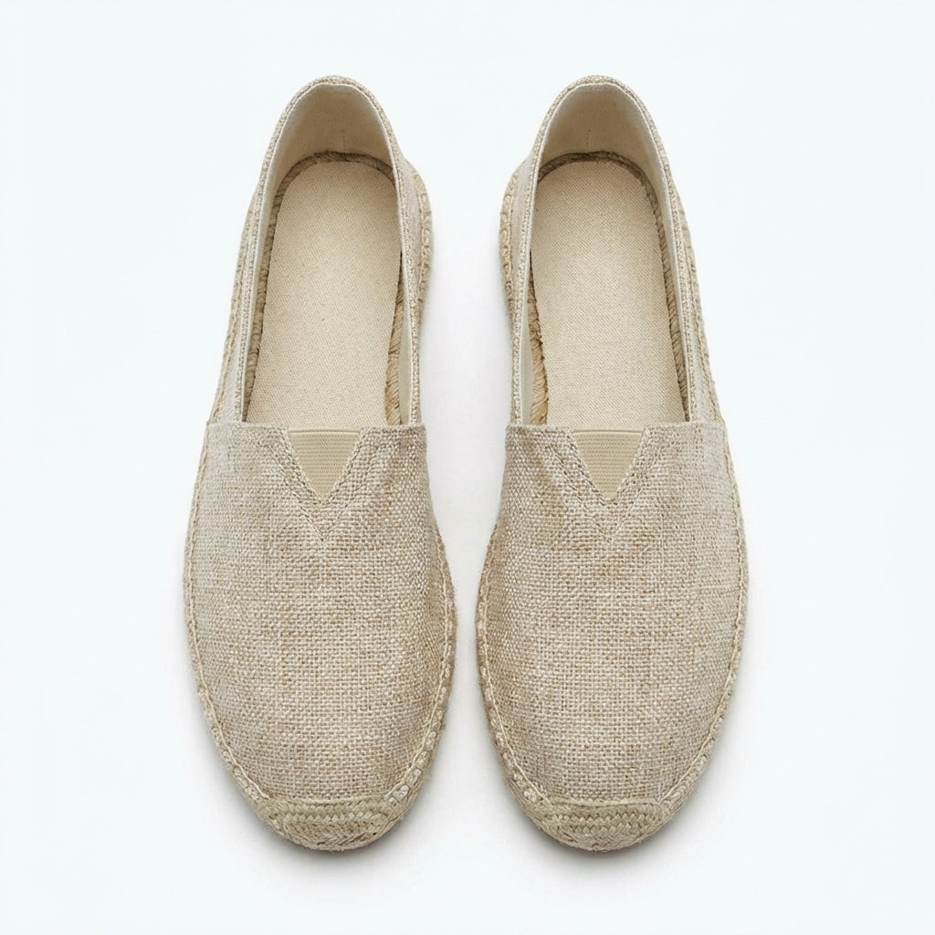 White men's slip-on espadrilles. Breathable summer loafers with hemp detailing, ideal for vacation comfort.