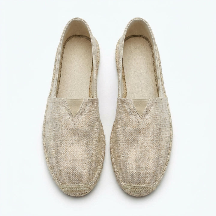 White men's slip-on espadrilles. Breathable summer loafers with hemp detailing, ideal for vacation comfort.