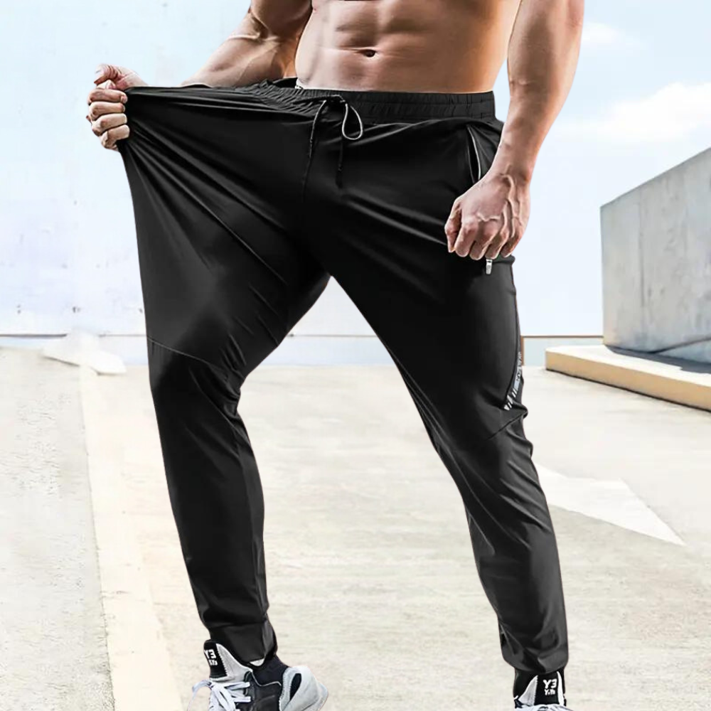 Stylish men's athletic trousers, offering lightweight comfort & breathability for all training types.