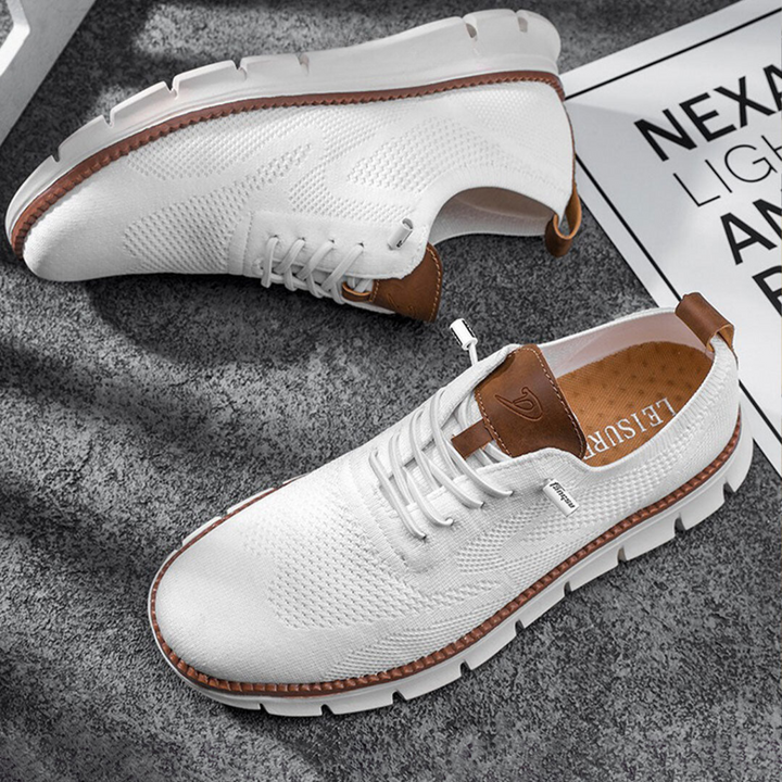Stylish men's lace-up sneakers offering lightweight comfort & breathability. Versatile casual shoes for athletic & everyday fashion.