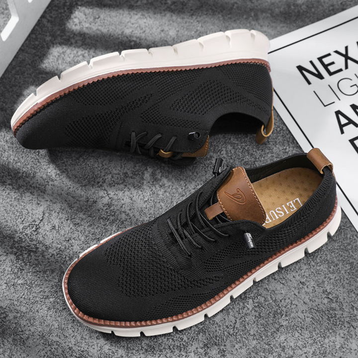 Side view of modern men's breathable walking shoes. Lightweight casual sneakers for summer and everyday comfort.