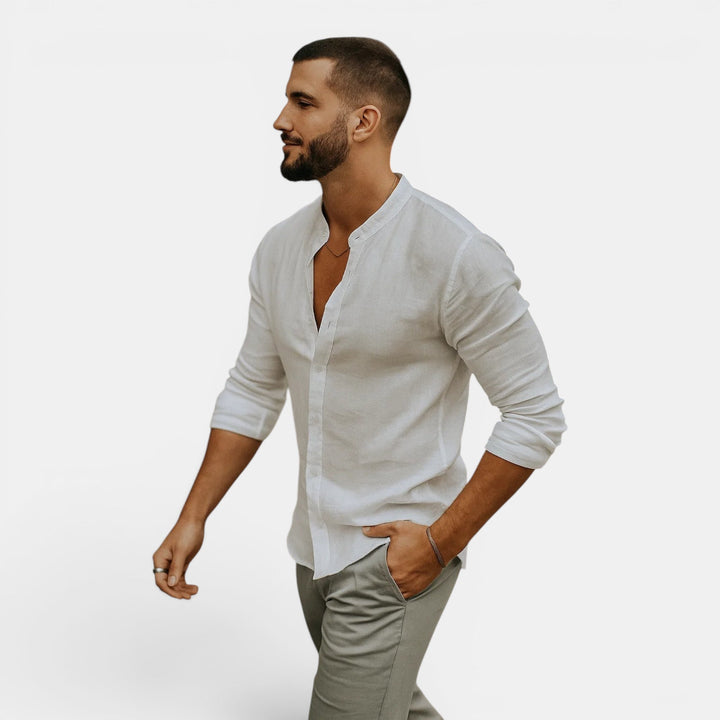 Model in a men's lightweight breathable long sleeve shirt with grandad collar, styled for casual summer outfits.
