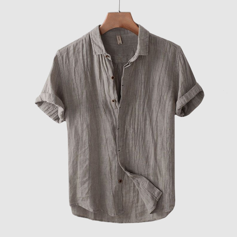 Stylish men's button-down short sleeve shirt, great for summer casual wear, beach trips, or resort outings.