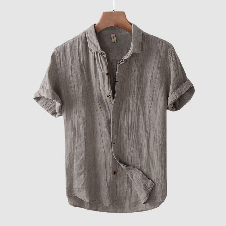 Stylish men's button-down short sleeve shirt, great for summer casual wear, beach trips, or resort outings.