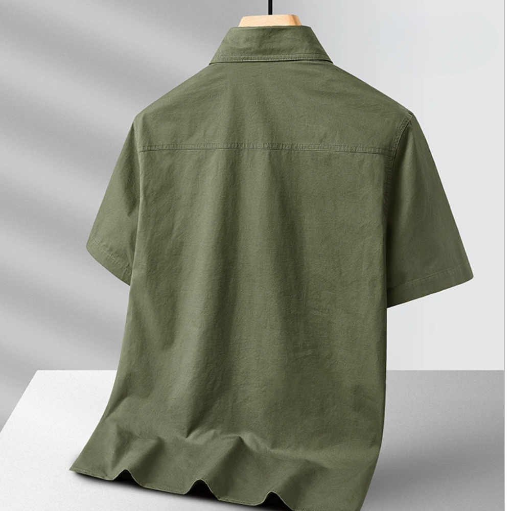 Versatile men's short-sleeve collared shirt with chest pockets, ideal for summer casual and outdoor activities.