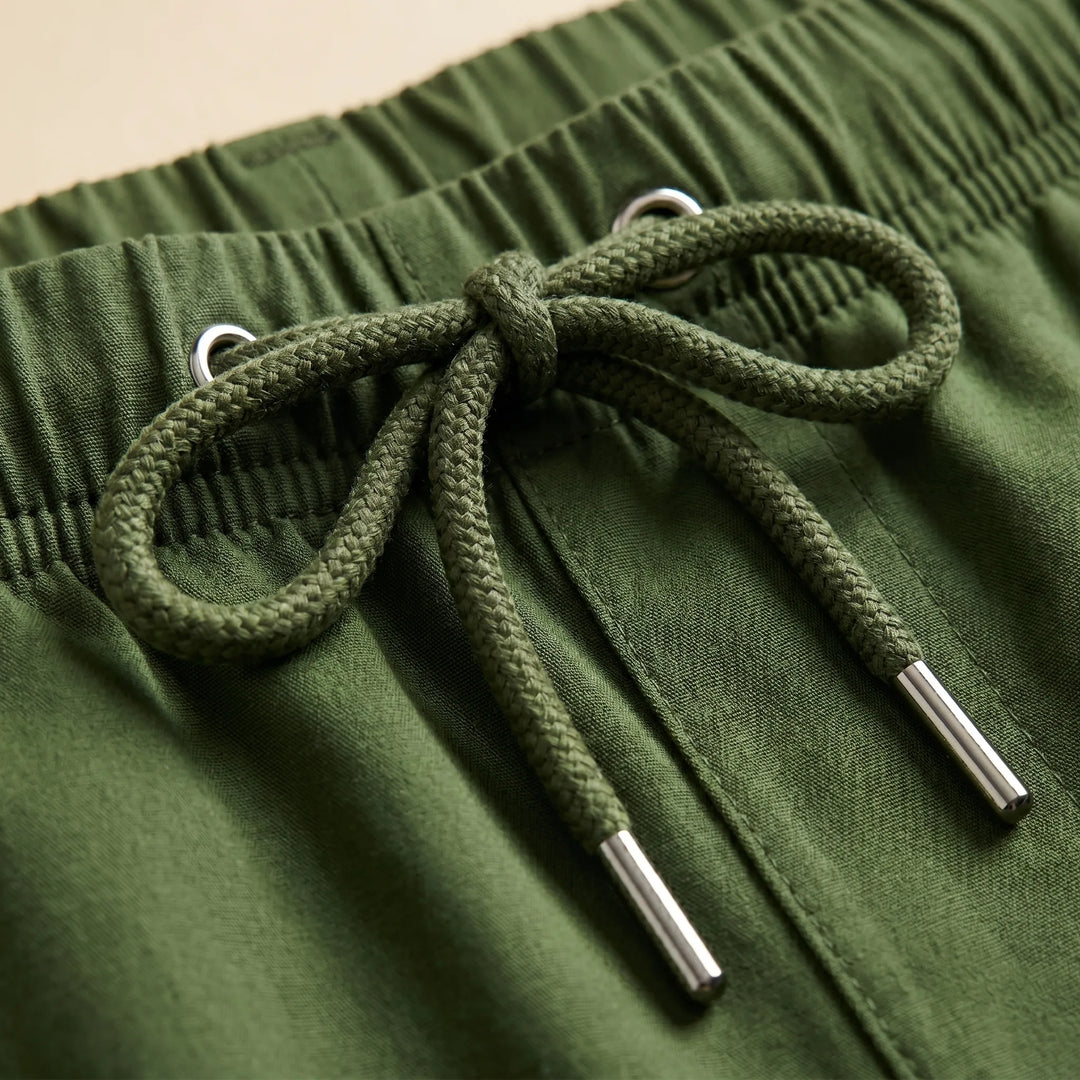 Practical men's lightweight utility shorts with drawstring waist, ideal for vacation and beach.