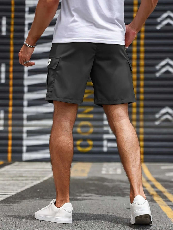 Front view of men's lightweight cargo shorts, comfortable elastic waist, multiple functional pockets.
