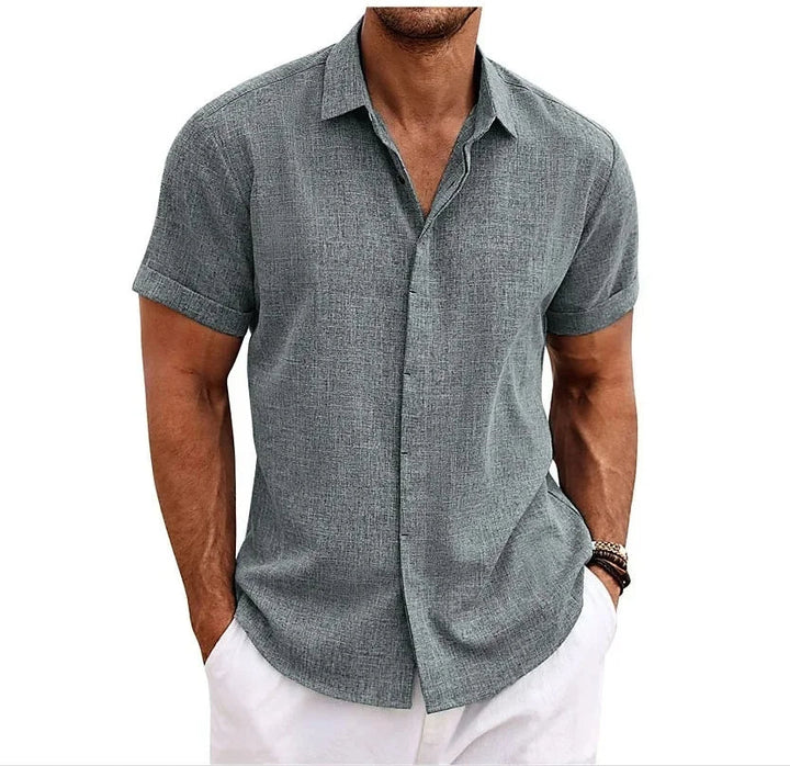 Relaxed fit men's button-up shirt, ideal for spring and summer. Lightweight & breathable for comfort.