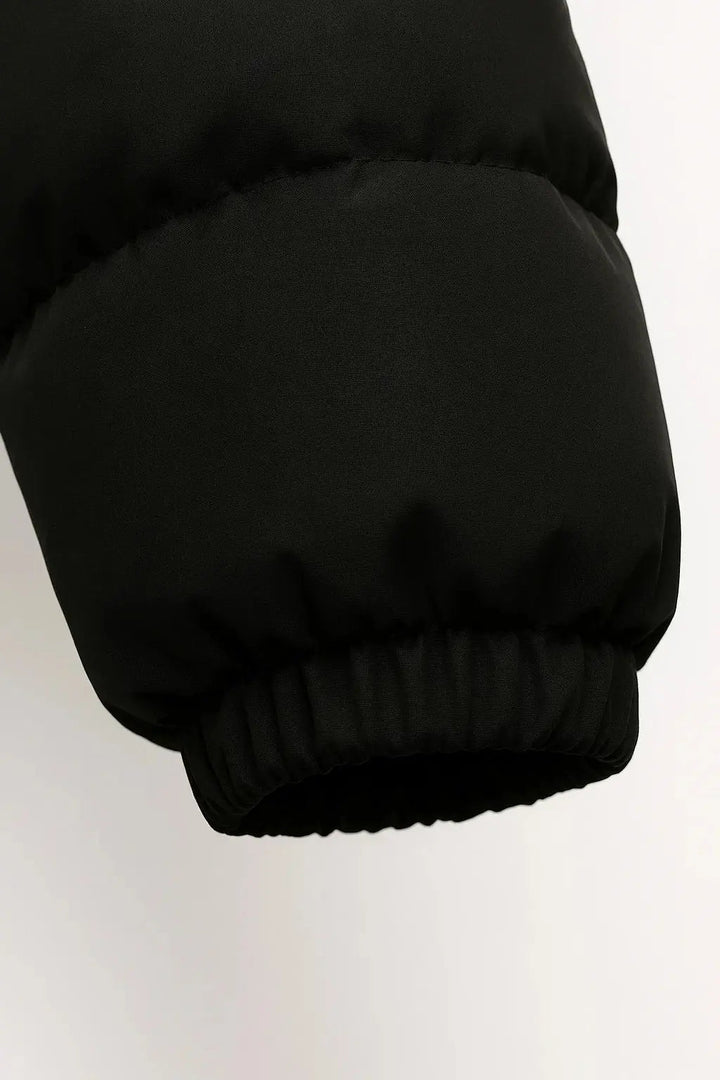 Insulated men's puffer jacket, lightweight & warm with a hood, great for cold weather outdoor gear.