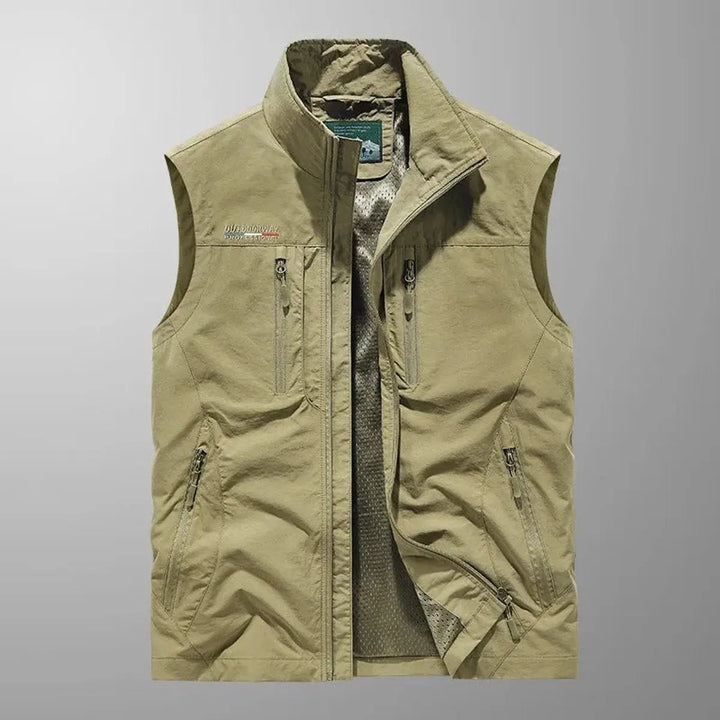 Man wearing lightweight outdoor travel gilet vest with many pockets, great for hiking & adventure.