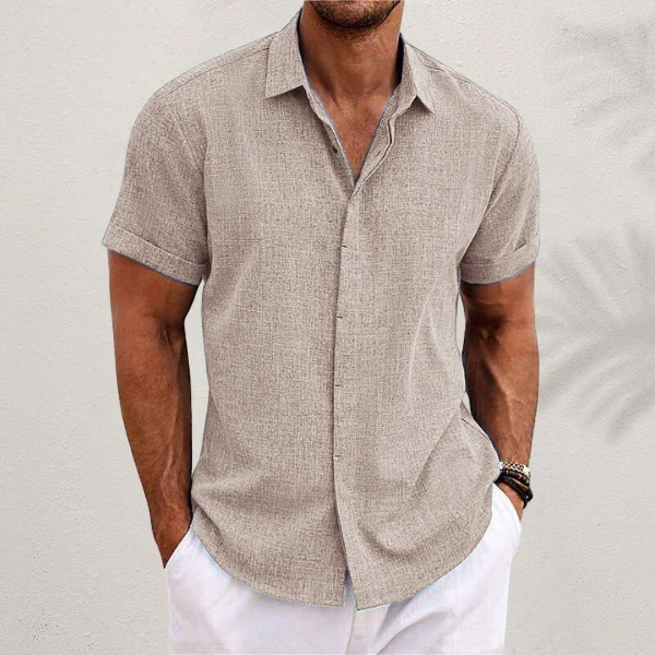 Summer men's fashion: a relaxed fit short sleeve button-up shirt, perfect for travel.