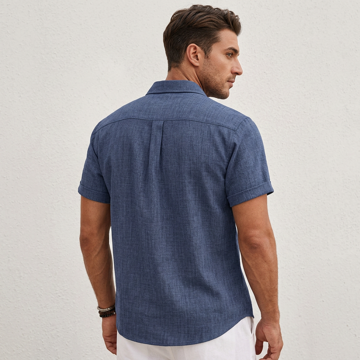 Lightweight men's button-up shirt, short sleeve and breathable, great for casual summer outings.