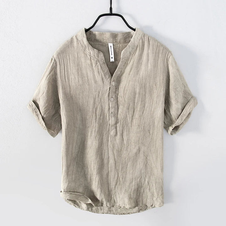 Casual men's Henley shirt with button placket, relaxed fit, and lightweight fabric ideal for summer & warm weather.
