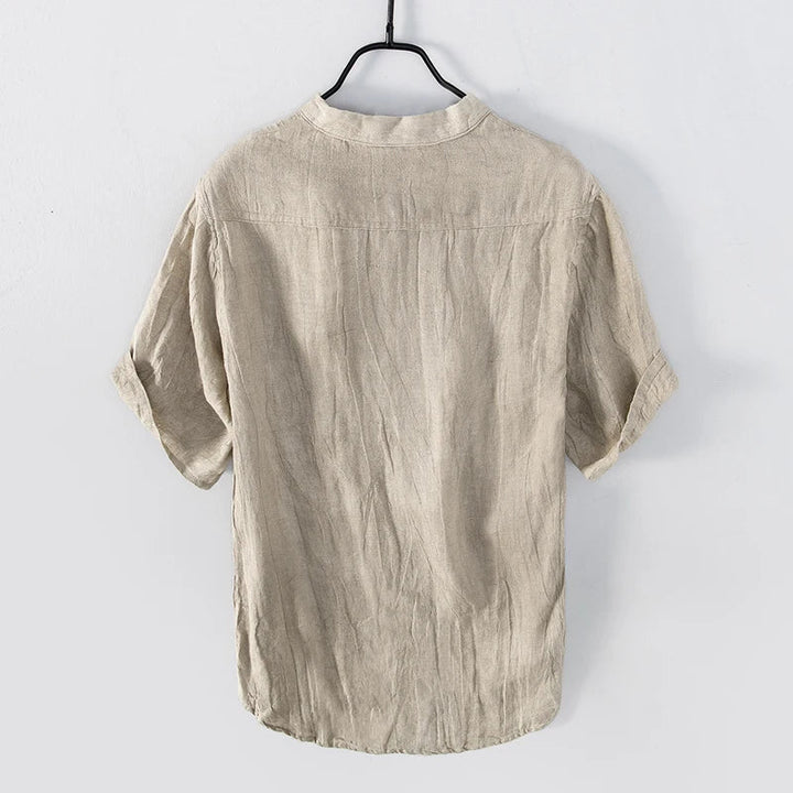 Stylish men's short-sleeve Henley shirt for summer, offering lightweight comfort & a relaxed fit for everyday wear.