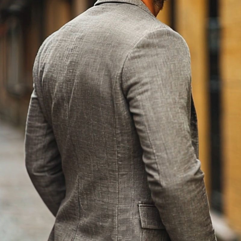Detail of lightweight men's blazer, a single-breasted jacket offering relaxed fit & smart-casual appeal.