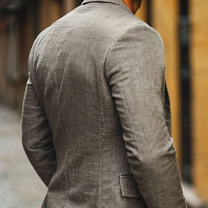 Detail of lightweight men's blazer, a single-breasted jacket offering relaxed fit & smart-casual appeal.