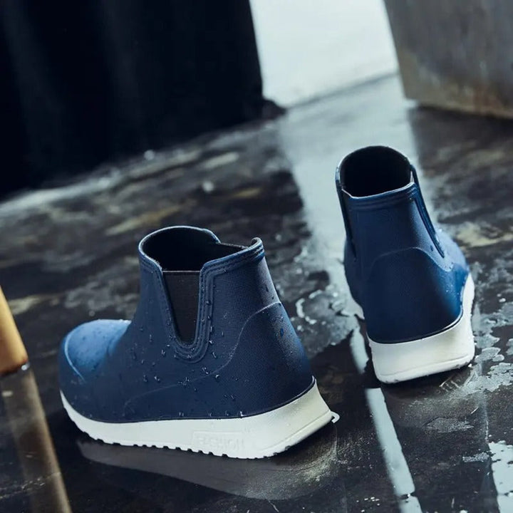 Men's waterproof slip-on ankle rain boots, durable for gardening, outdoor utility, and wet weather.