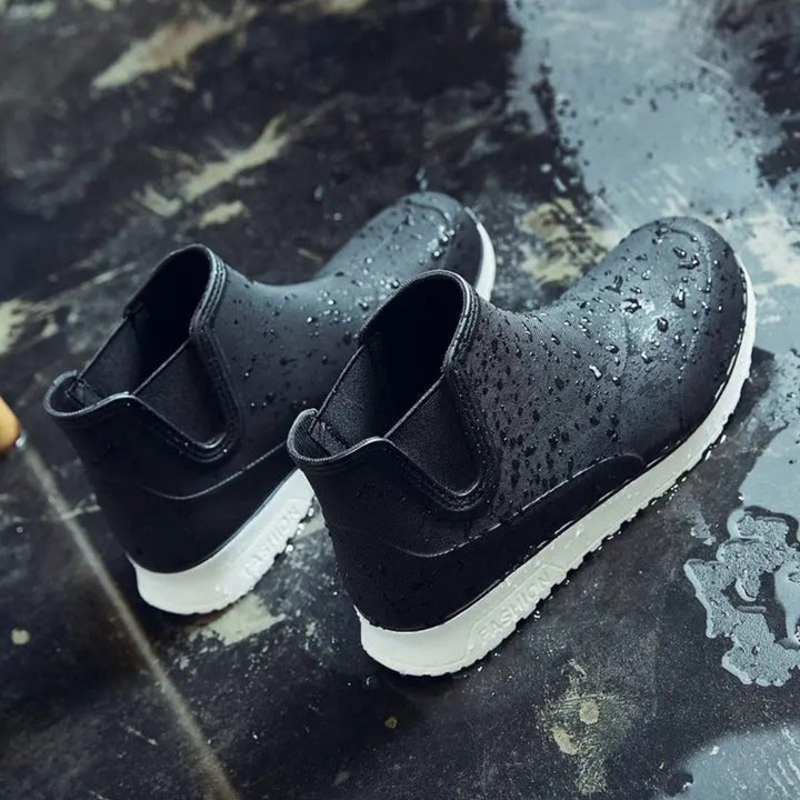 Men's durable slip-on garden boots, waterproof and comfortable ankle-height footwear for wet conditions.
