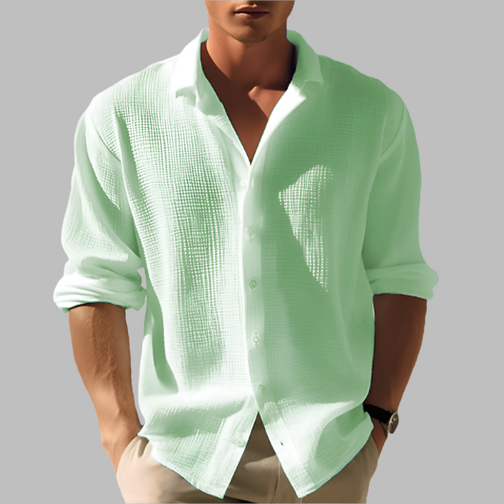 Lightweight men's solid long sleeve shirt, great for beachwear, vacation, or relaxed summer style.