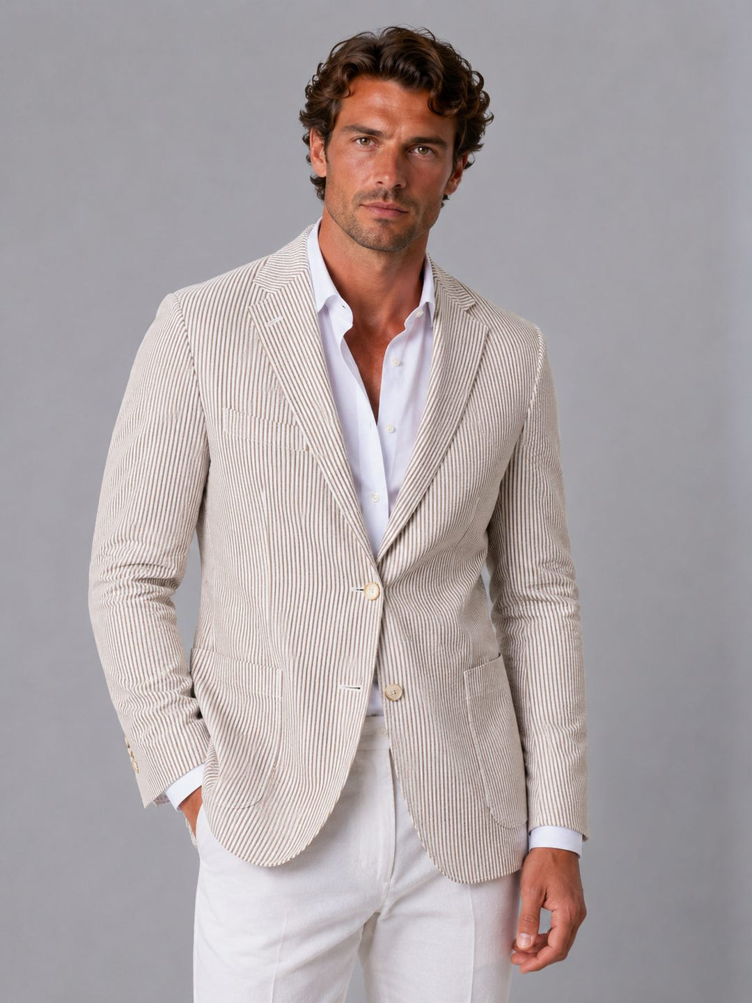 Men's striped blazer, a smart-casual lightweight jacket ideal for office wear. Modern men's fashion blazer.