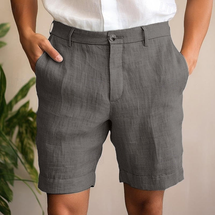Stylish man wearing comfortable blue lightweight chino shorts, ideal for effortless everyday summer wear.