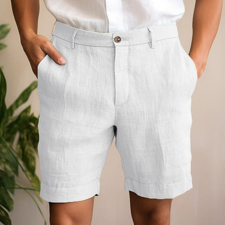 Man enjoying outdoors in comfortable green lightweight chino shorts, perfect for active summer days.