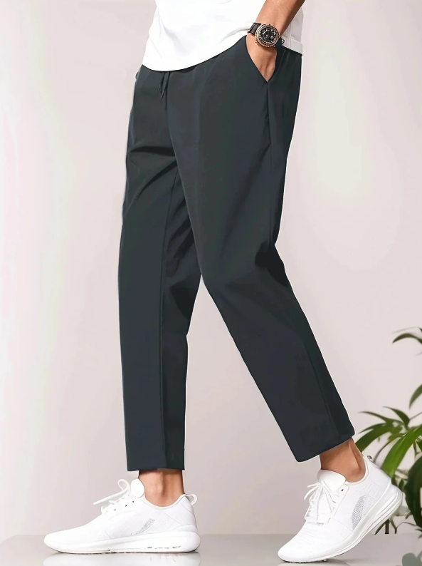 Comfortable men's tapered casual pants with elastic waist, ideal for travel and daily comfort.