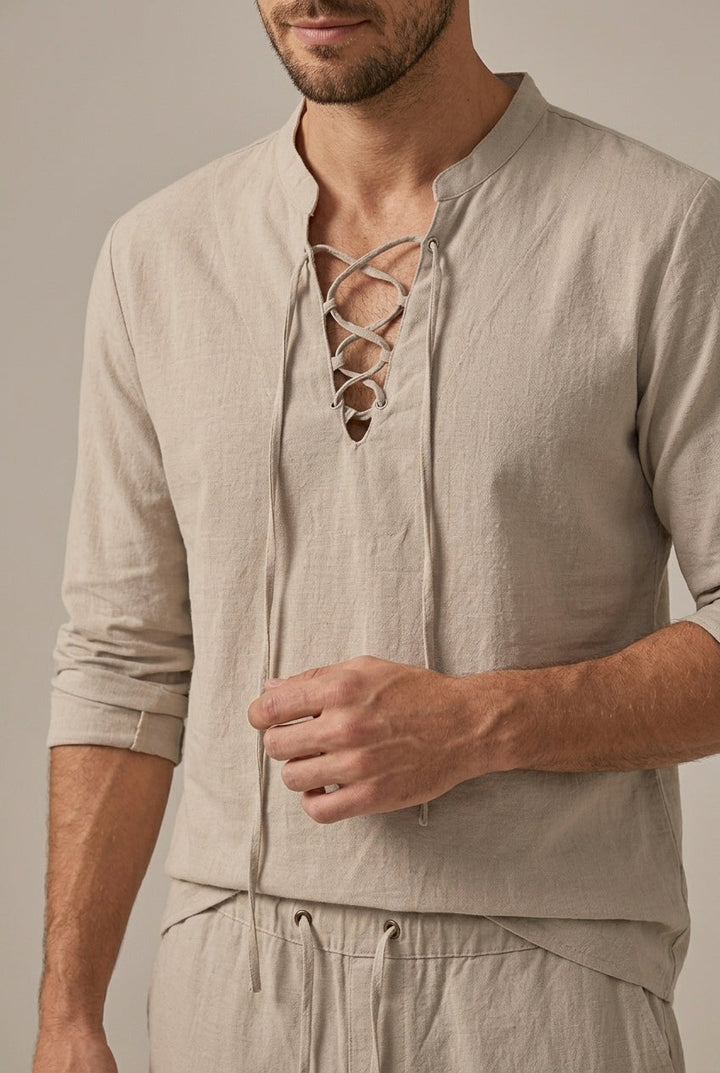 Stylish men's two-piece linen blend set with long sleeve v-neck shirt and wide leg pants, perfect for beach or travel.