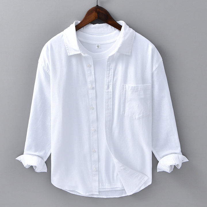 Stylish men's summer button-down shirt, ideal for beachwear or smart casual occasions. Long sleeve, versatile top.