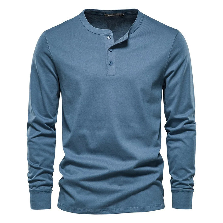 Men's long-sleeve henley shirt with button placket & round neck for smart casual style.