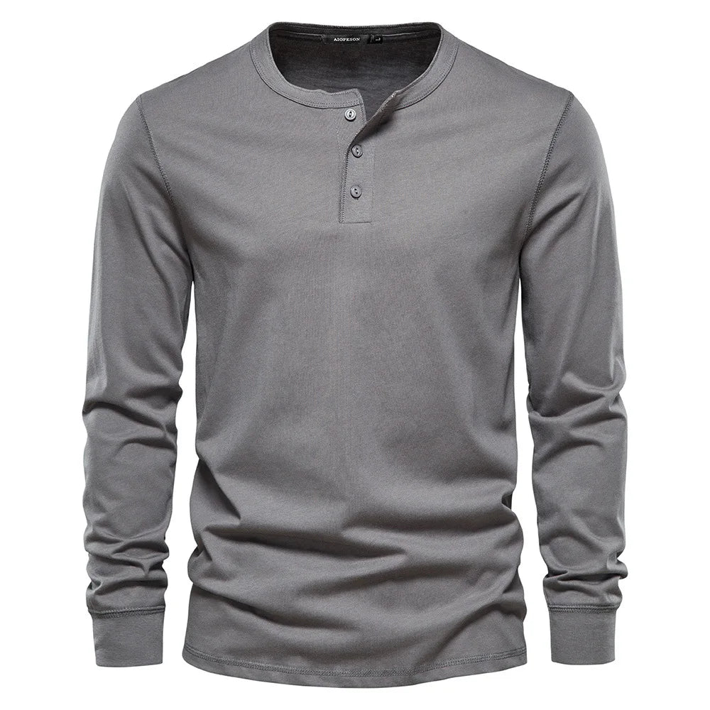 Classic men's long-sleeve henley shirt featuring a button placket & round neck for versatile style.