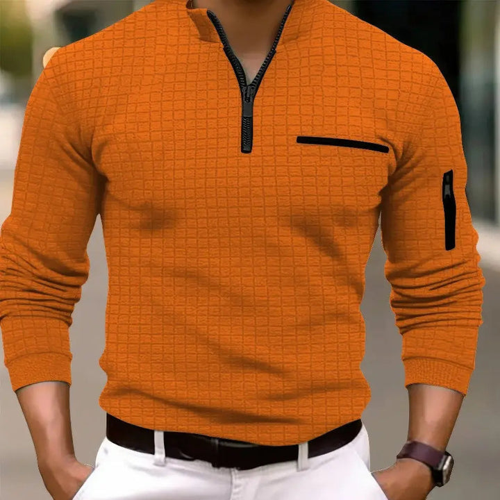 Modern men's long sleeve polo shirt in a casual style, featuring a sleek zipper pocket. Fashionable everyday top.