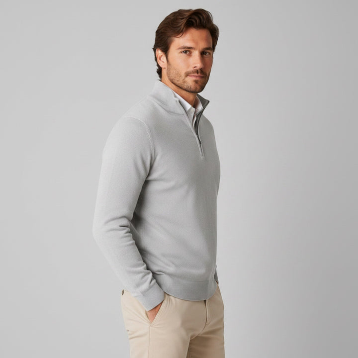 Stylish men's quarter zip sweater in navy, great for both casual and professional settings.
