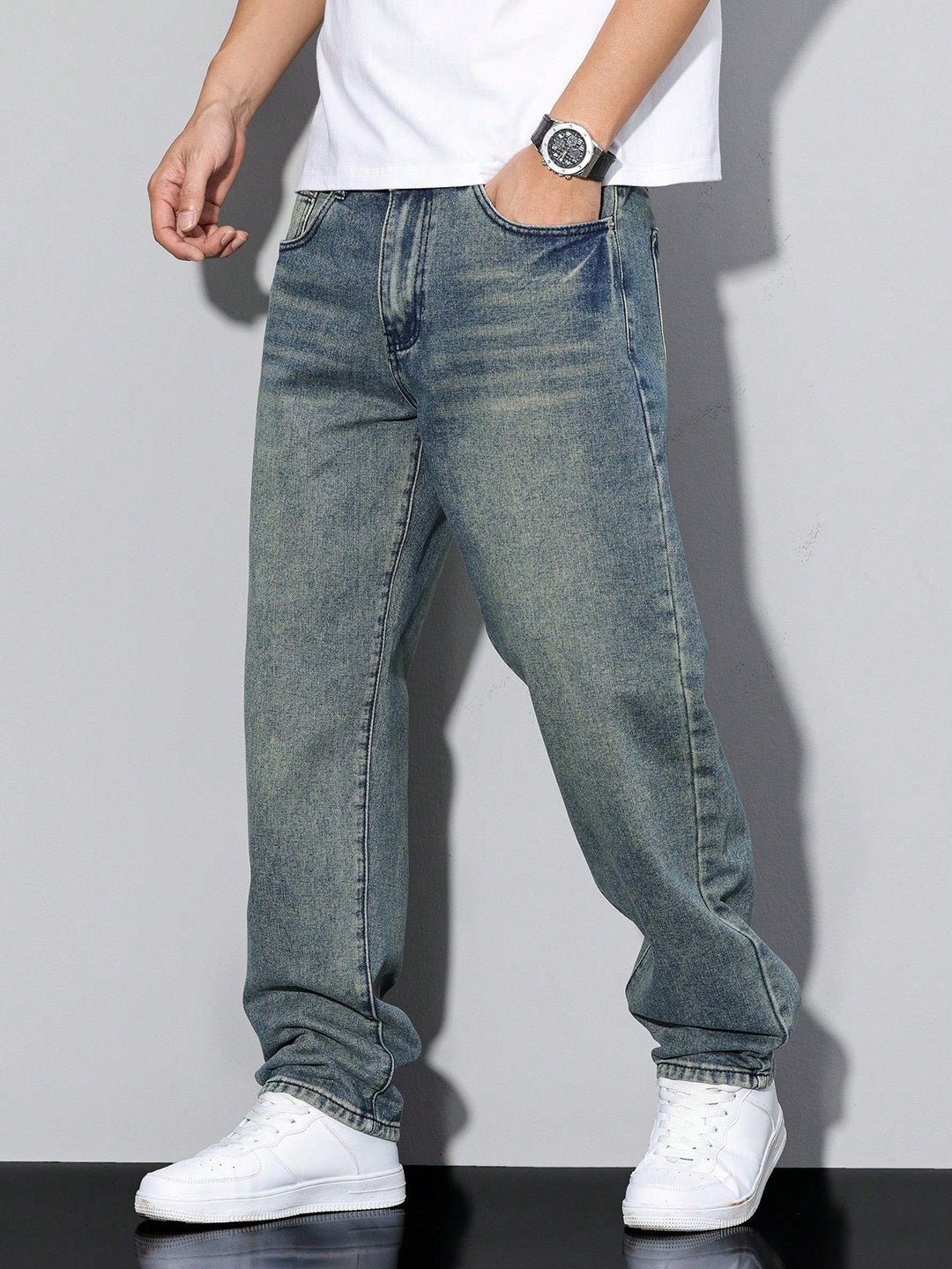 Versatile men's loose fit washed denim trousers, a wardrobe essential for casual everyday styling.