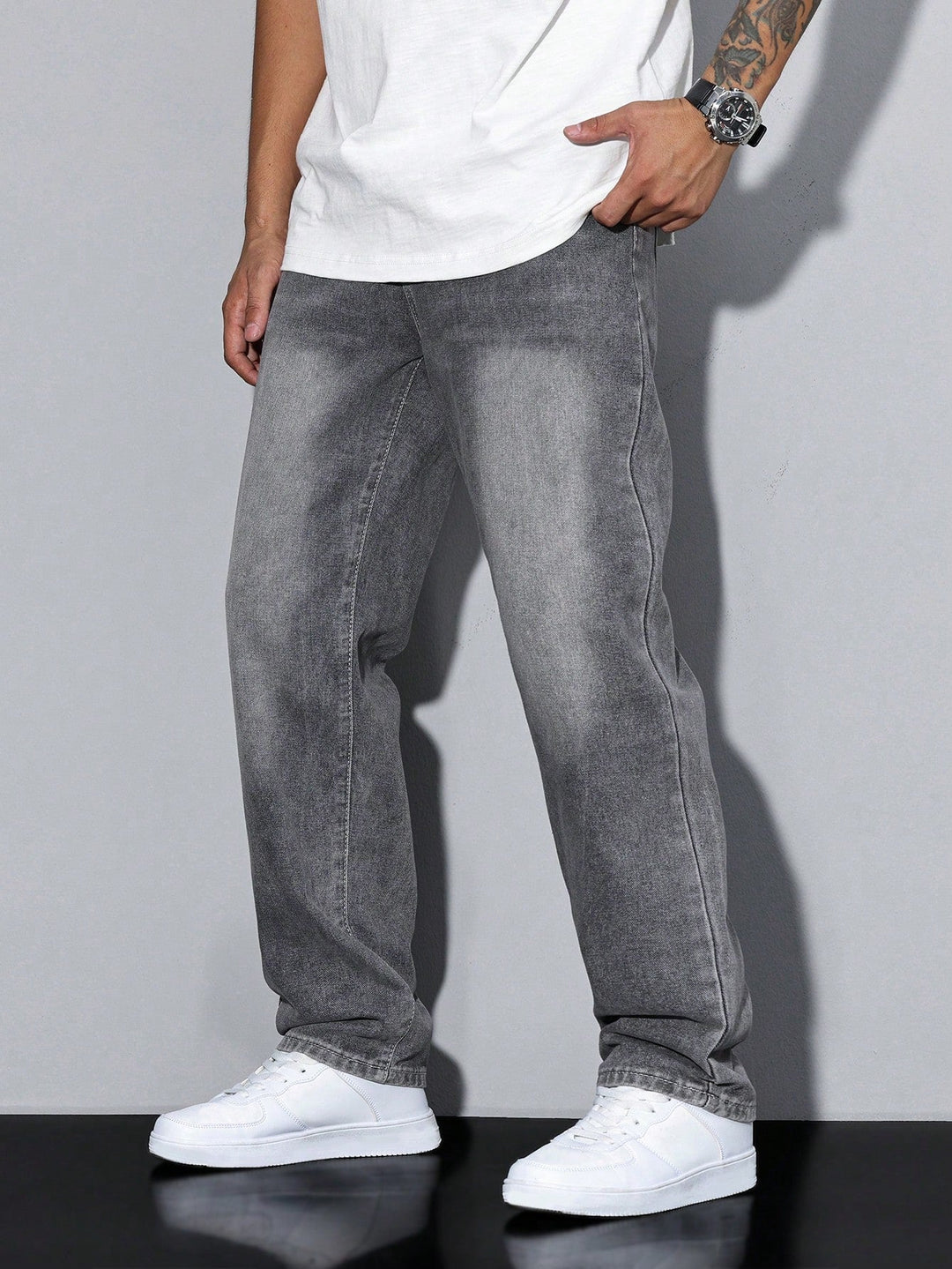 Classic blue washed denim trousers for men, featuring a straight leg and comfortable loose fit.