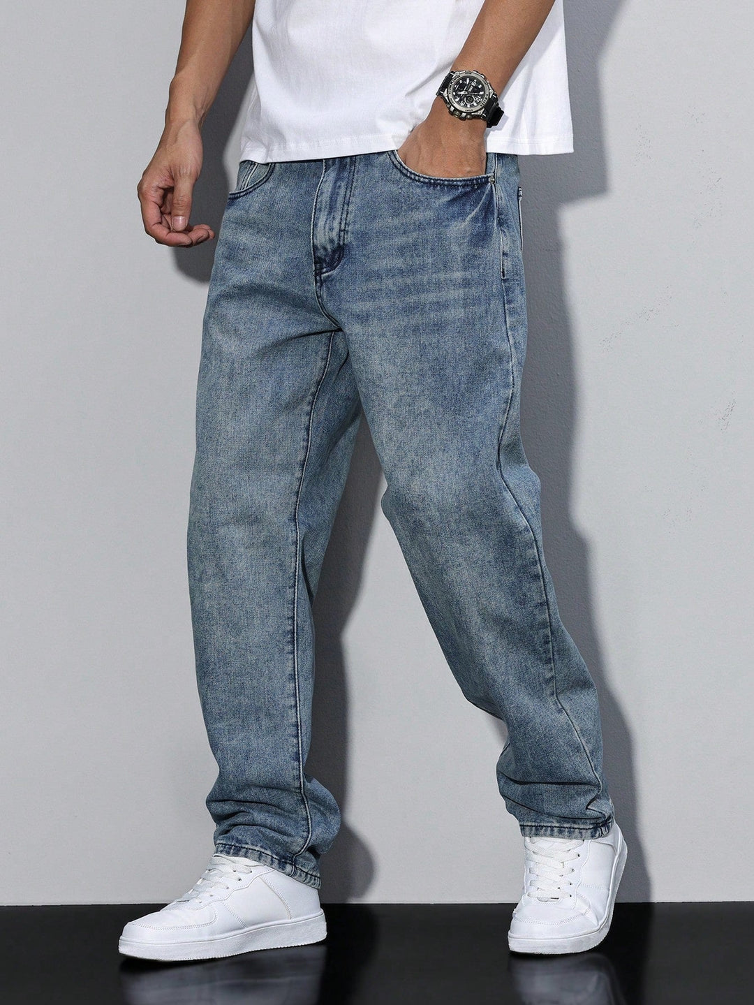 Dark wash men's denim trousers with a relaxed loose fit and classic straight leg. Everyday bottoms.