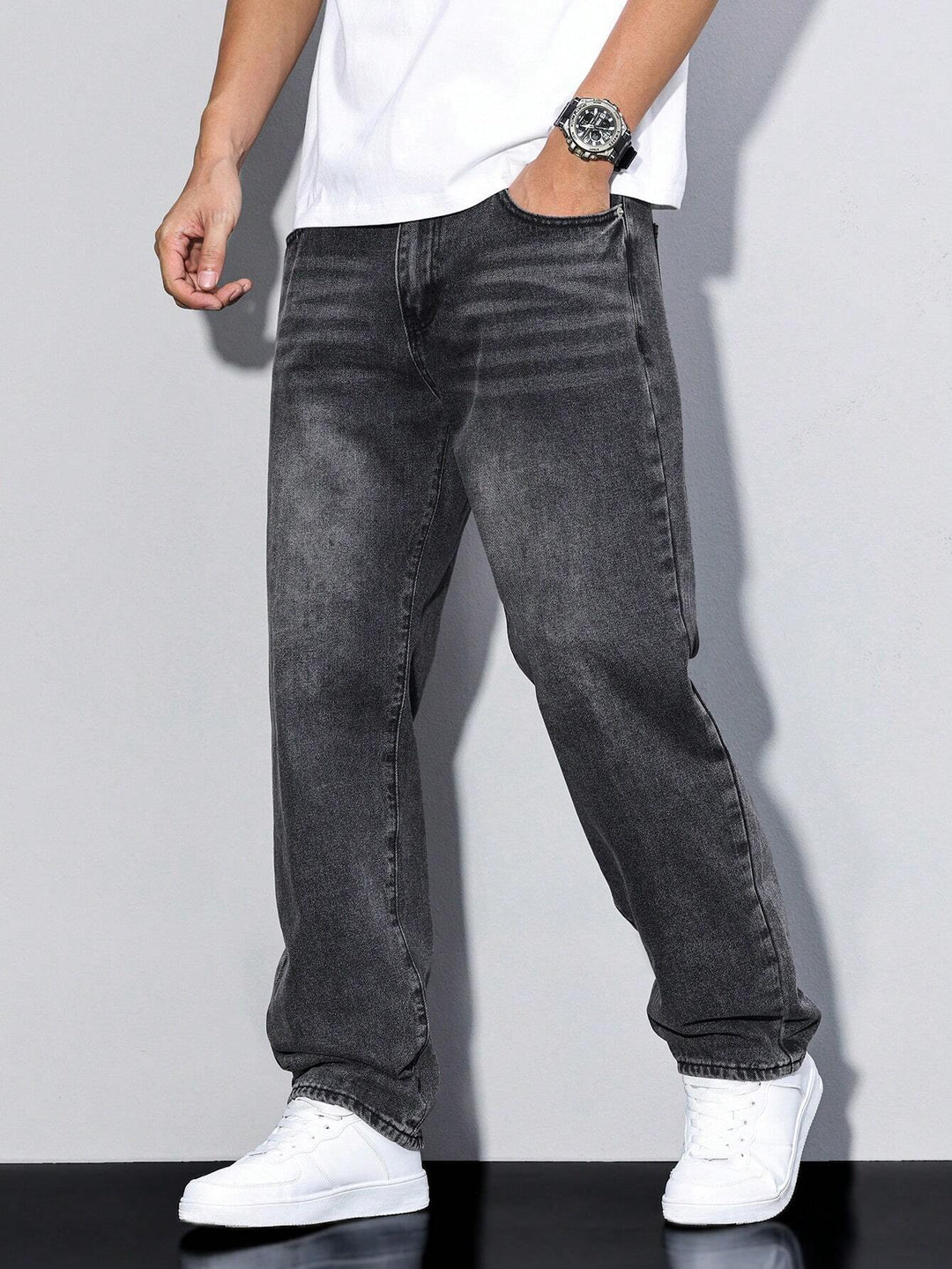 Stylish men's washed denim pants, offering a loose fit and straight leg for ultimate comfort.